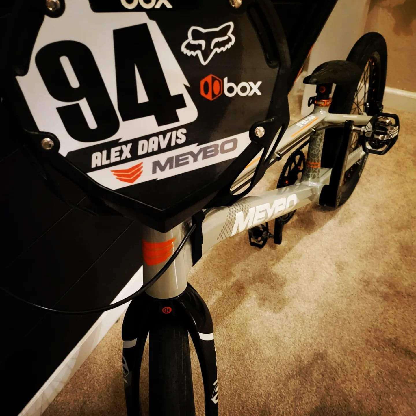 Black and white number 94 plate mounted on a MEYBO BMX bike